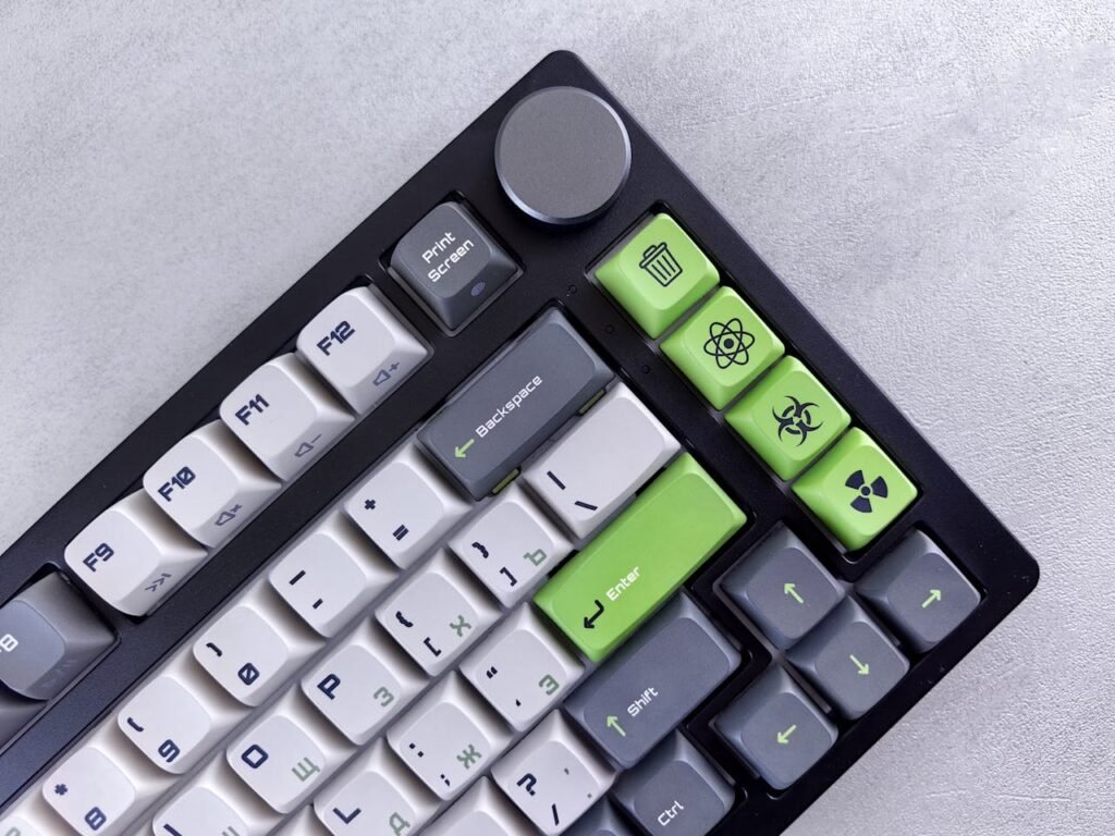 A green and white keyboard with a black and white key